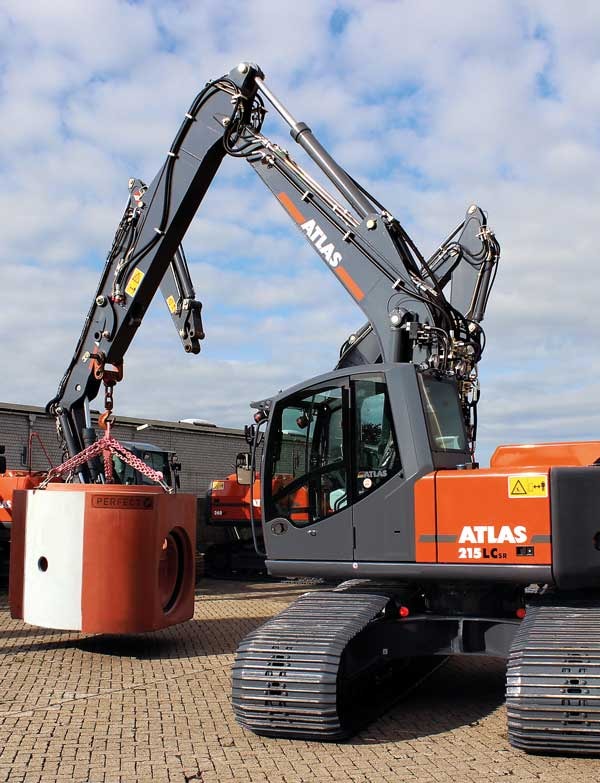 Atlas excavator lifting concrete block